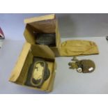 Two boxed gas masks, a forage cap and a pouch of vintage military badges etc