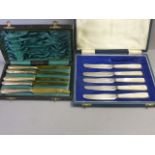 A set of five silver fruit knives caused and set of 5 knives cased