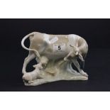 A Lladro figure of a cow and a pig