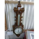 Large ornate wooden barometer