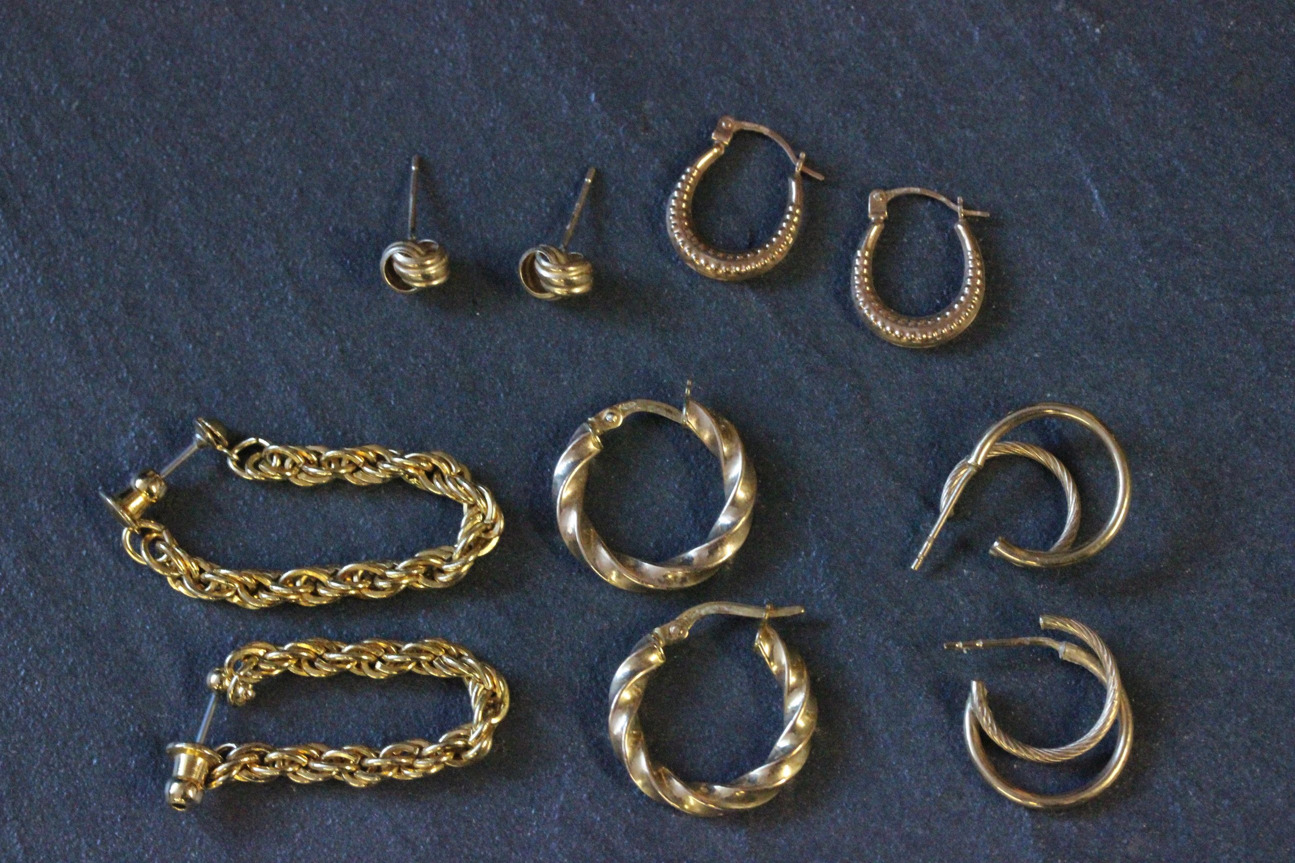 Two pair of 9 carat gold earrings, along with three other pair of earrings