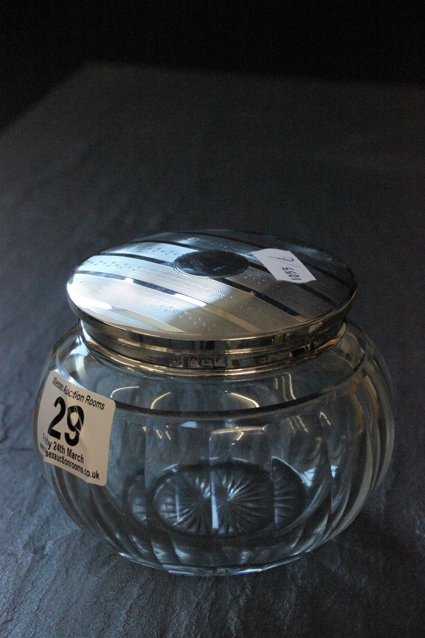 A silver topped glass toilet jar with engine turned cover and vacant cartouche, London 1926