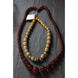 Amber colour graduated bead necklace with an Ivory & silver bead necklace