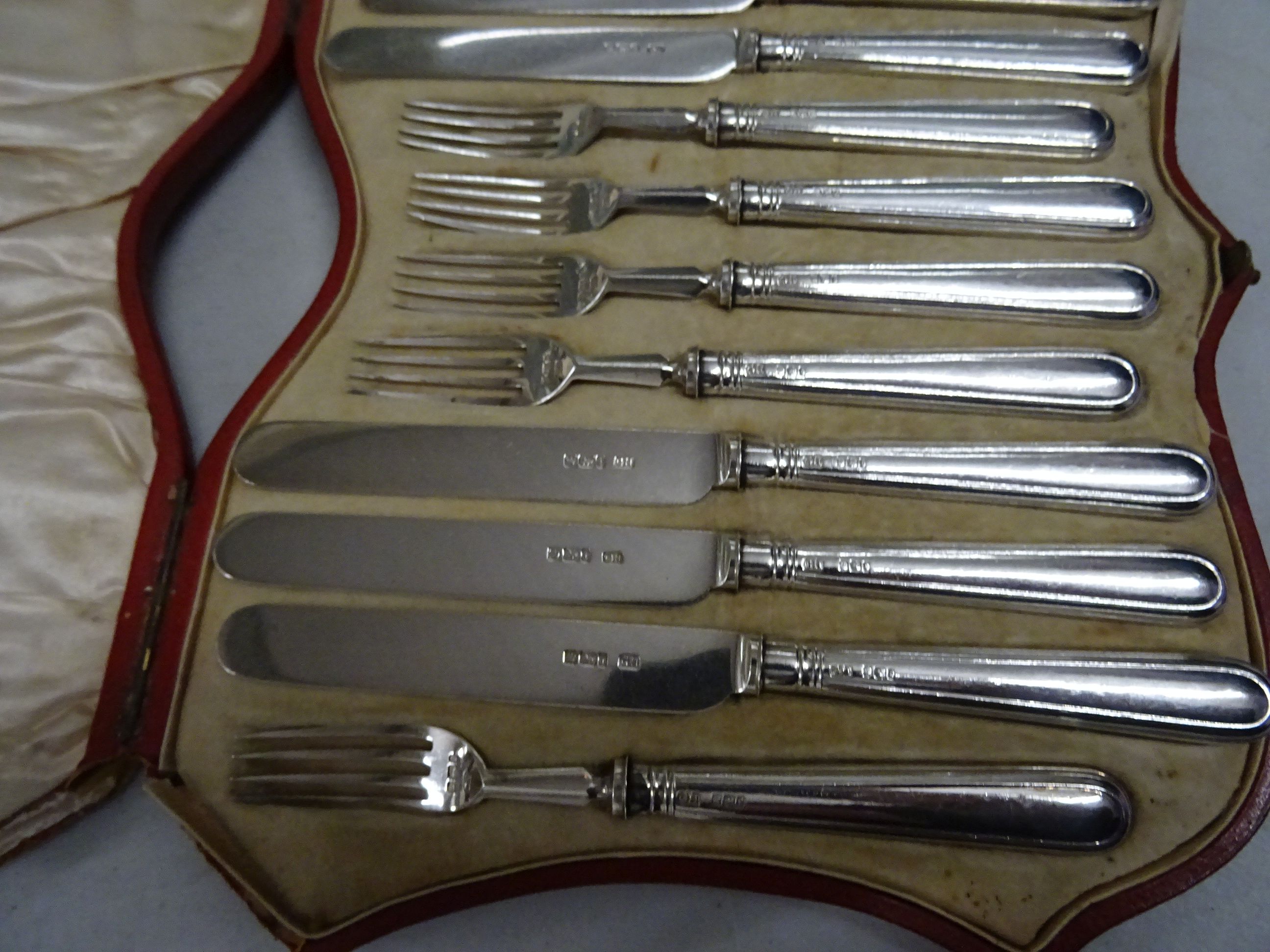 A cased set of of silver dessert 6 fork and 6 knives, in a red leather fitted case, Sheffield 1927 - Image 2 of 3
