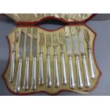 A cased set of of silver dessert 6 fork and 6 knives, in a red leather fitted case, Sheffield 1927