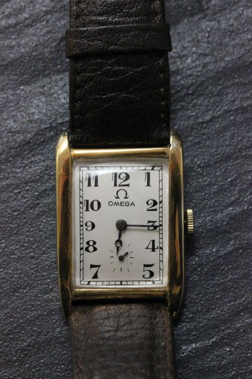 Gents 14k gold Omega wrist watch, tank style with vintage leather strap