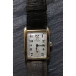 Gents 14k gold Omega wrist watch, tank style with vintage leather strap