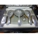 A five piece silver backed dressing table set, with engine turned decoration, each piece with a