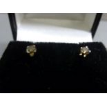 Pair of white gold fancy colour diamond stud earrings of .18 points