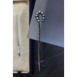 Boxed gold horseshoe tie pin with seed panel and turquoise