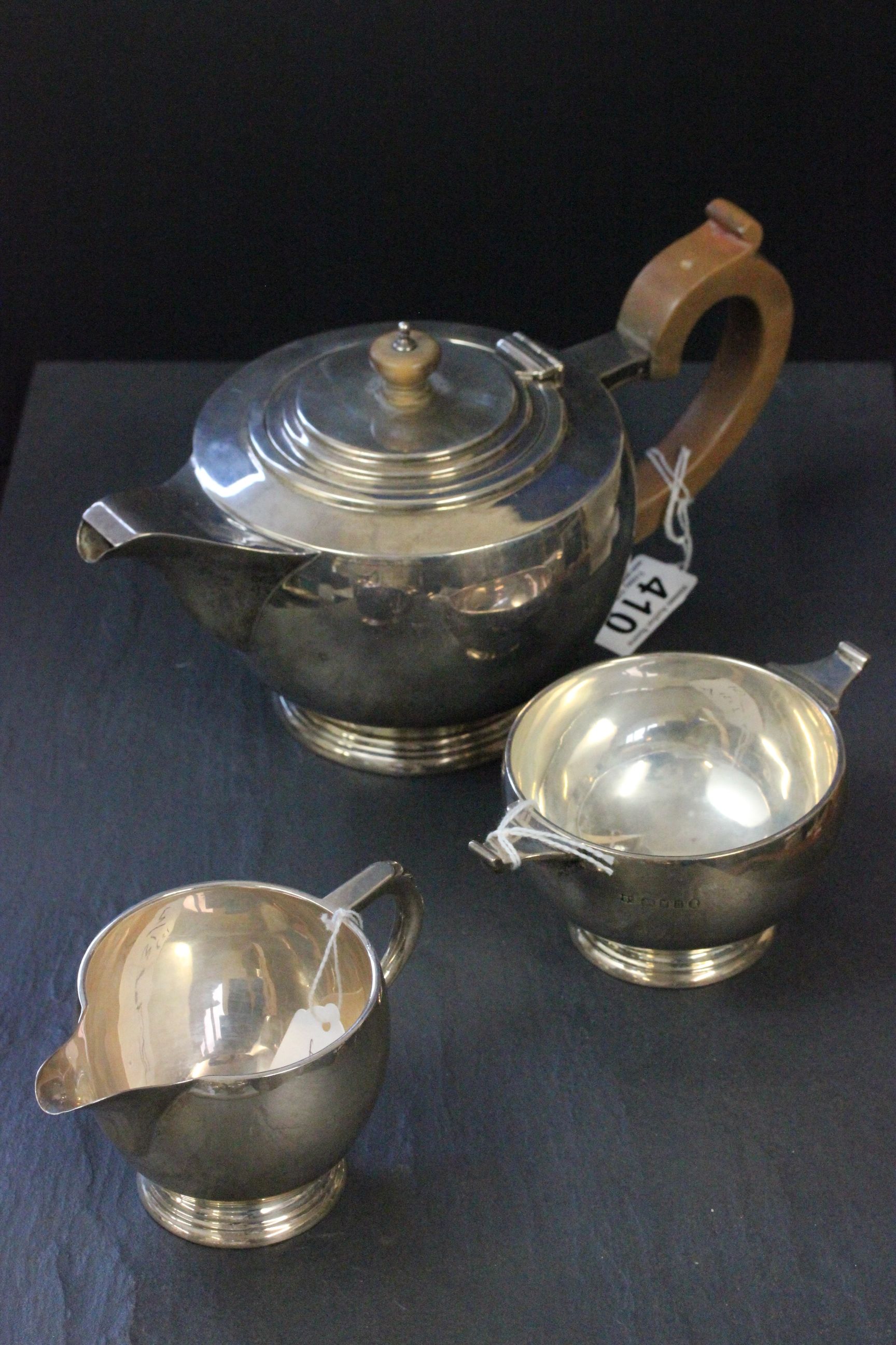 A three piece silver tea service, comprising teapot, sugar bowl and milk jug, London 1936