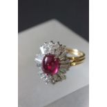 18ct Yellow gold ruby & diamond oval cluster ring with one cabochan cut ruby stone and 14 diamonds