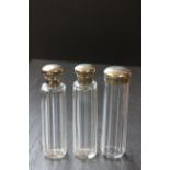 Three silver topped glass toilet jar, various dates