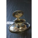 A 20th century oval silver capstan inkwell with glass insert, Birmingham, 1924, A & J Zimmerman