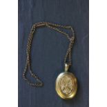 Large gold locket on 9ct gold chain