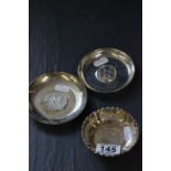 Three silver coin dishes, one set with Maria Theresa Thaler