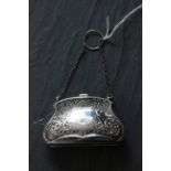 An Edwardian silver silver purse, with a leather interior, Birmingham 1911