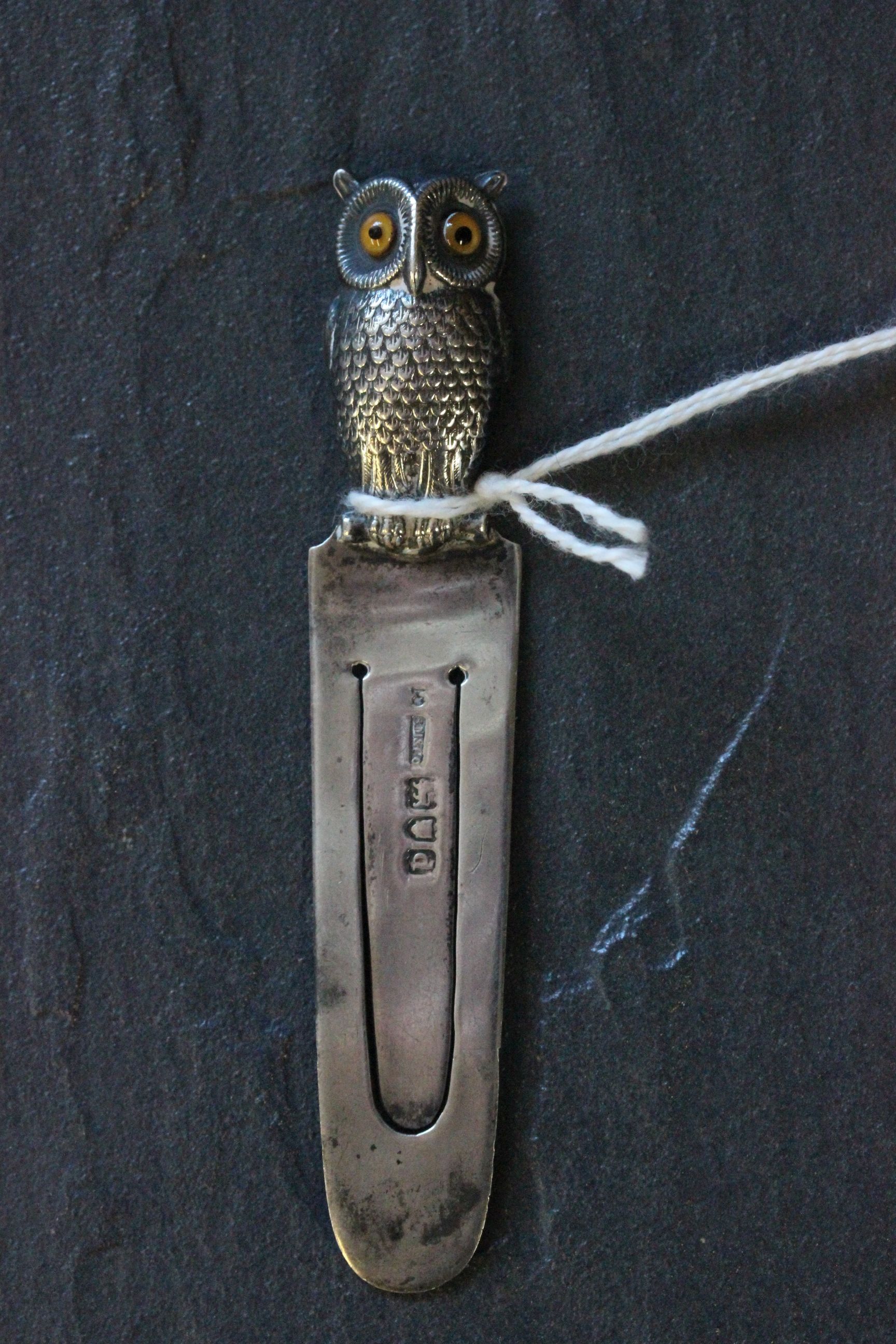 A silver book mark with owl finial set with glass eyes, London 1900, Samson & Mordan