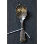 A Victorian silver caddy spoon with a shell bowl, London 1853