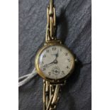 Boxed 15 jewel patent 18ct gold J.W.Benson wrist watch with 9ct gold strap