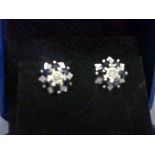 Pair of white gold sapphire and diamond earrings