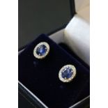 Pair of 18ct white gold sapphire and diamond cluster earrings of 1.7ct's