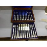 A cased Edwardian set of 12 silver dessert knives and forks, London 1904, Francis Higgins, in a