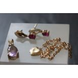 Mixed gold jewellery including amethyst pendant, ruby earrings and bracelet