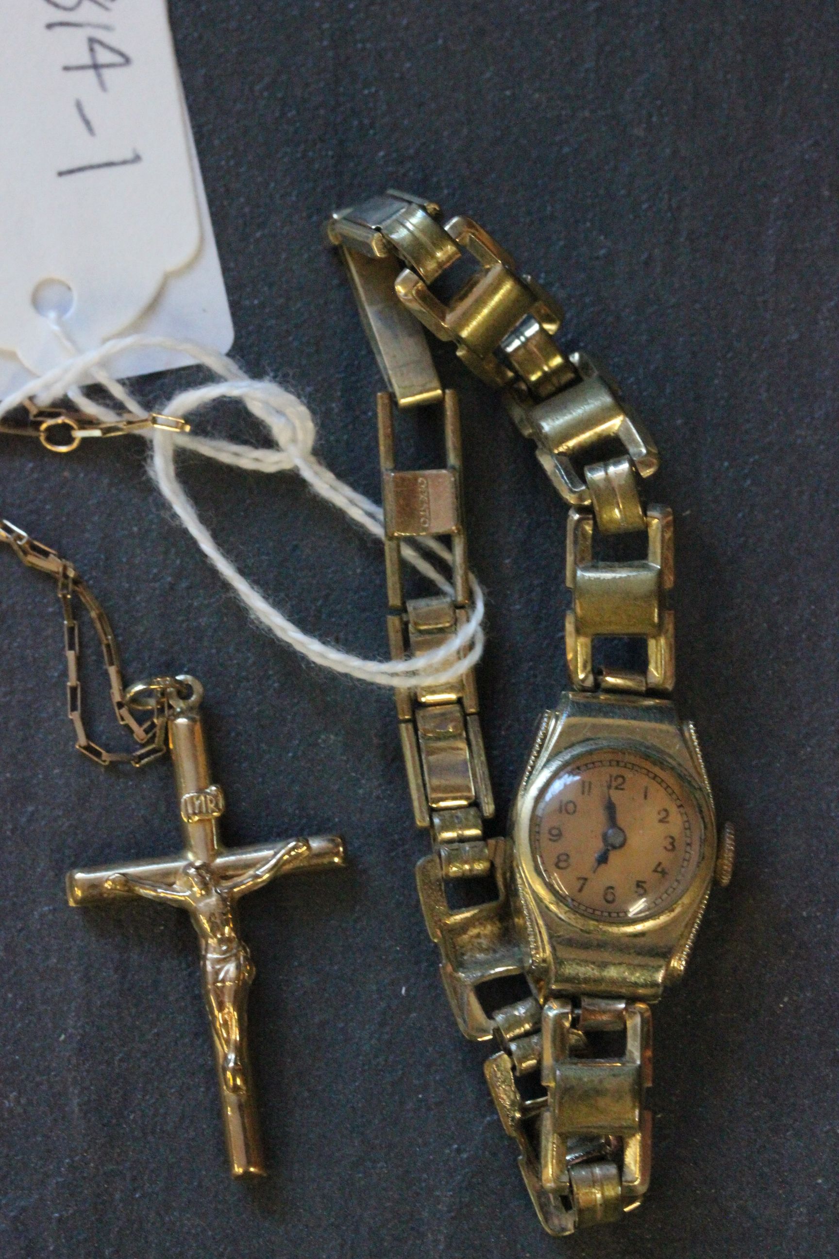 9ct gold crucifix pendant with 9ct gold chain and yellow metal ladies wrist watch