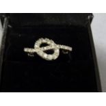 14ct White gold unusual diamond ring in the form of a knot