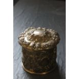 A 19th century silver gilt German jar and cover, with embossed decoration throughout, the based