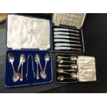 A set of silver teaspoons, Sheffield 1936, along with a cased set of knives each with silver handle