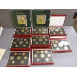 Eight boxed uncirculated year sets, along with two penny sets