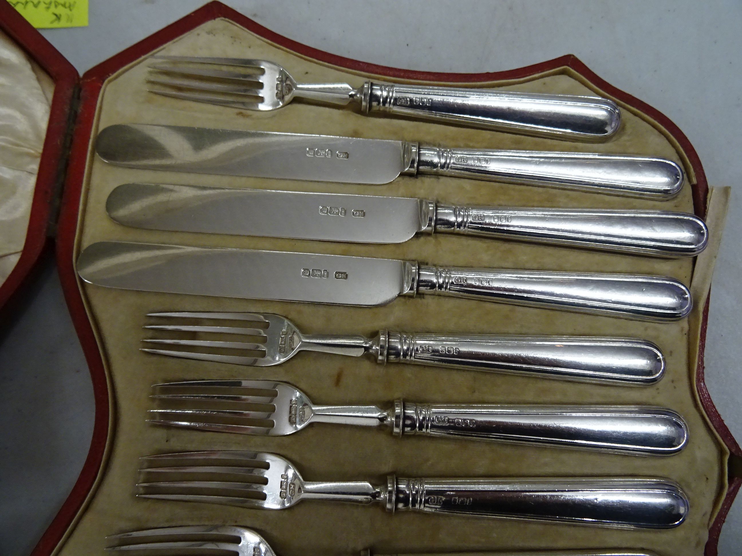 A cased set of of silver dessert 6 fork and 6 knives, in a red leather fitted case, Sheffield 1927 - Image 3 of 3