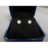 Pair of 14ct white gold diamond stud earrings of 1.25ct's