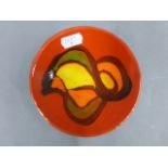 Poole Pottery Delphis pin dish with red base colour, 12.5cm in diameter