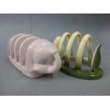 A pink Carlton Ware four section toast rack in the form of an elephant, 17cm long, along with