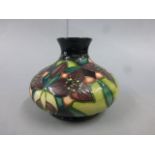 Moorcroft Pottery squat vase of stylized petals with impressed and painted marks, 2000, 11cm in