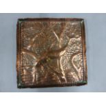 An Arts & Craft hammered square copper dish, in the Newlyn style, decorated with fish, 18.5cm