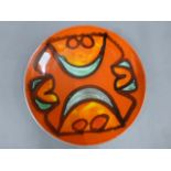 Poole Pottery Delphis dish by Adriana Fontana in red ground, shape 3, signed AF to base