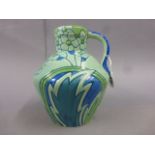 A Thomas Forrester & Son Phoenix Classic ware jug decorated with flowers foliage, 20cm high