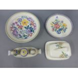 Four items of Art Deco style Poole Pottery to include shallow bowl, plate, cruet set and butter