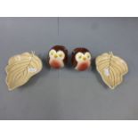 A pair of Carlton Ware salt and peppers in the form of Robins, along with a two Carlton Ware leaf
