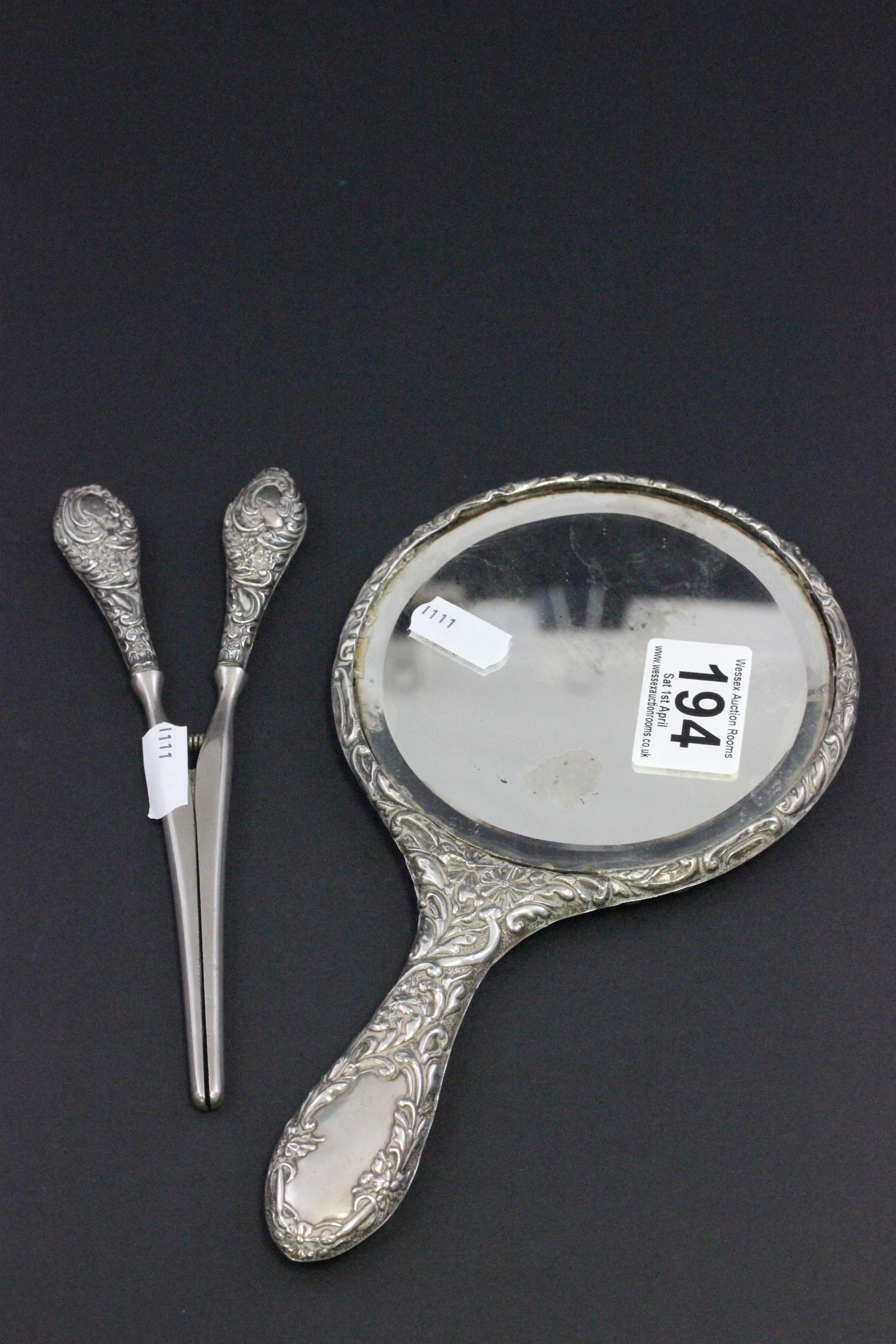 Pair of silver handled glove stretchers and a silver backed hand mirror