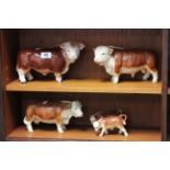 Group of porcelain bulls and calves, one marked Melba Ware