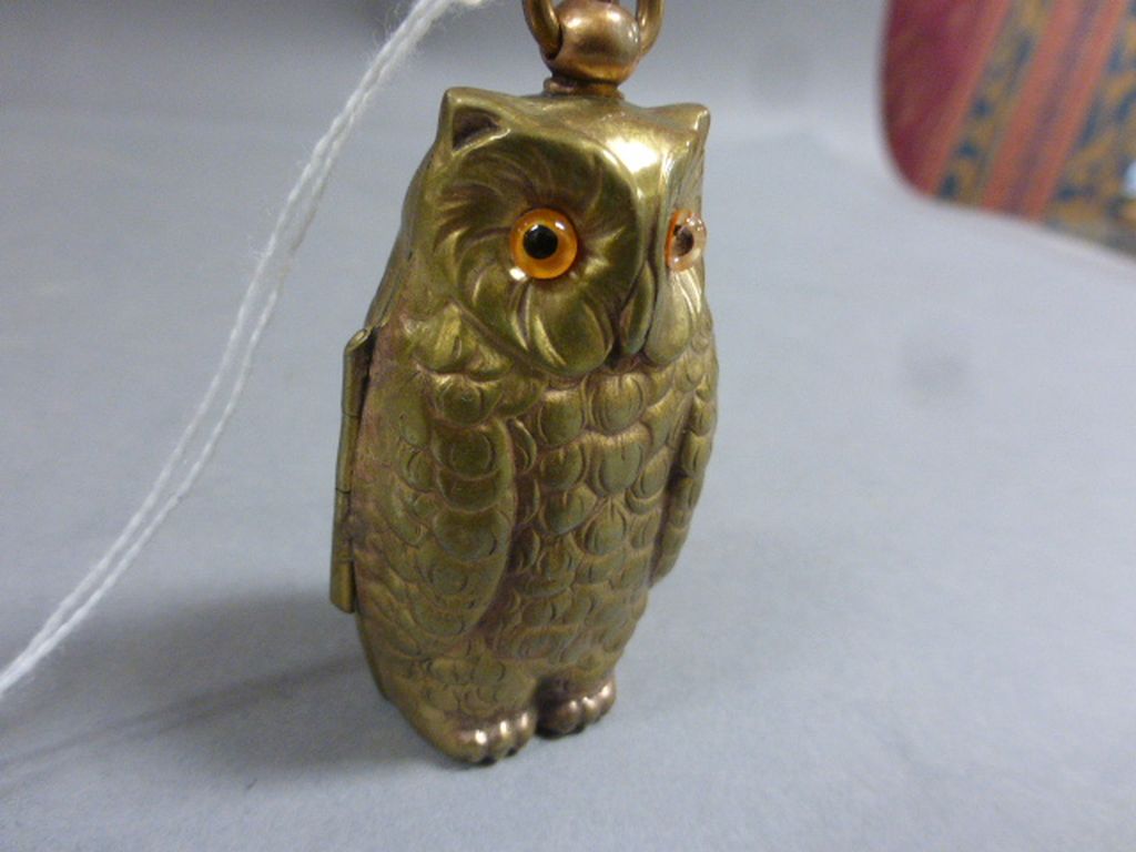 Brass cased owl shaped half and full sovereign case