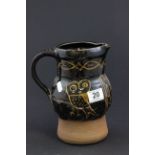 Large earthenware jug with slipware design