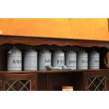 A set of 7 vintage blue enamel kitchen containers, along with two matching shovels