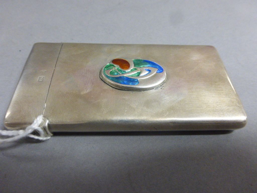 A silver and enamel card case, of rectangular form, with oval Art Nouveau motif, Birmingham 1912,