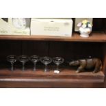 Five vintage Babycham glasses and an African carved wooden Rhino